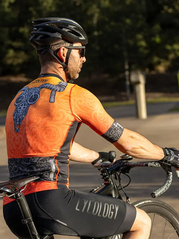 Life Behind Bars Orange Men's Reborn Jersey  Back view on model | Cycology AUS