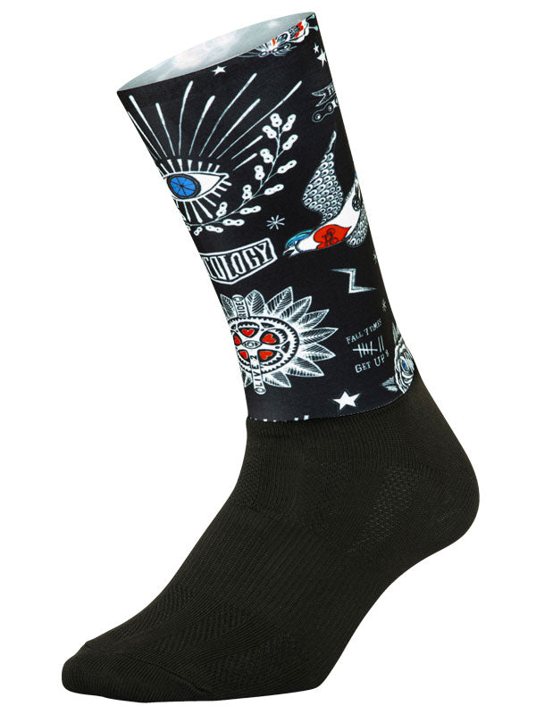 Tattoo Black Aero Cycling Socks. Featuring a two-part construction with a form fitting aero upper sock that provides a light compressive, flexible fit and a lower layer to provide breathability and support.